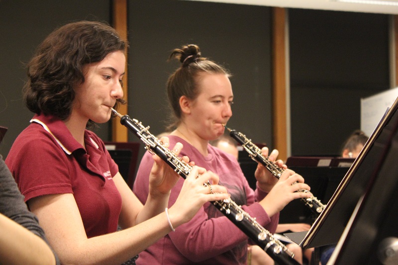 woodwind students rehearsing in an orchestral setting